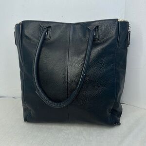 Halogen Pebble leather tote in black with cow hair zebra strip when expanded